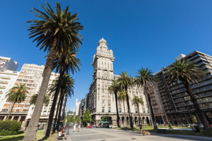 Historic architecture and palm-lined boulevard in Montevideo, Uruguay, reflecting the city's unique blend of European heritage and South American lifestyle Title