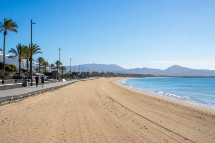 Quiet beach promenade during the off-season with only a few joggers and an empty coastline under a clear blue sky