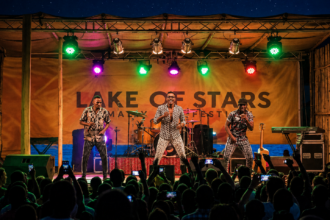 Lake of Stars music festival in Malawi with performers on stage and a crowd in front of Lake Malawi