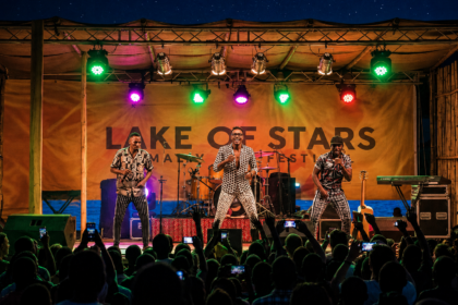 Lake of Stars music festival in Malawi with performers on stage and a crowd in front of Lake Malawi
