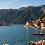 View across the Bay of Kotor in Montenegro with mountains and historic waterfront villages