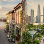Split image comparing Penang and Kuala Lumpur, highlighting Malaysia's coastal island lifestyle and modern urban living.