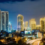Modern skyline of Metro Manila, Philippines, highlighting the country's urban infrastructure and healthcare accessibility