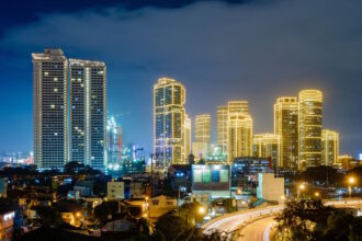 Modern skyline of Metro Manila, Philippines, highlighting the country's urban infrastructure and healthcare accessibility